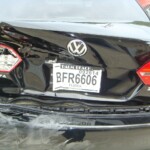 Before and after photographs of a damaged black Volkswagon Jetta that was repaired by Elite Paint & Body Shop in West Palm Beach, Florida.